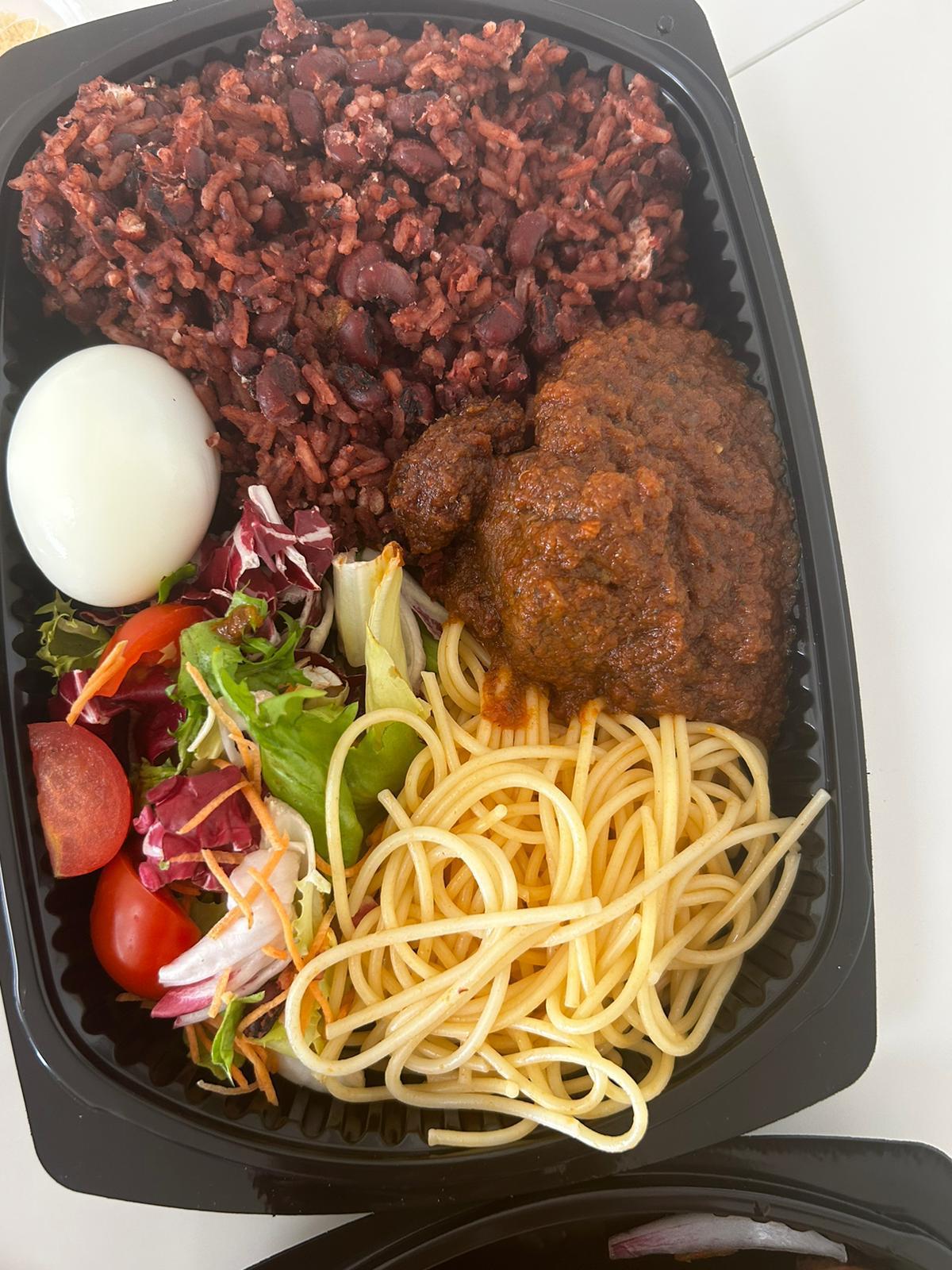 Waakye with rice and beans served with stew